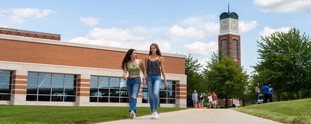 students walking outside Grand Valley building